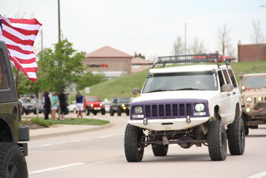 A line of Jeeps and some other vehicles went by for nearly 20 minutes near Cherry Hills Community Church for a May 15 memorial service for Kendrick Castillo in Highlands Ranch.